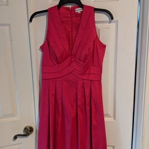 A vintage flamingo pink pleated dress. Knee Length